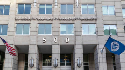 US Immigration and Customs Enforcement building entrance flags