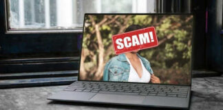 Laptop screen with a scam warning image.