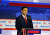 Judge Slams DeSantis Terror Crackdown Man in suit speaking at Fox News event.