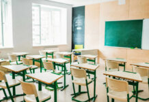 Classroom Shock: Lifelike ‘Teacher’ From Adult Brand Empty classroom with desks facing a chalkboard