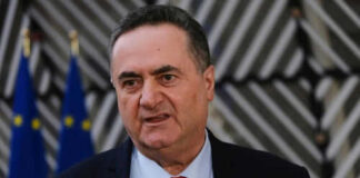 Man speaking with multiple microphones in front of him