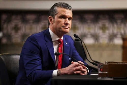 pete-hegseth2586168539jpg Man in blue suit speaking at a microphone