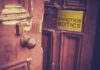 Squatter Crackdown Backfires—Wild New Hustle Booms Weathered wooden door with eviction notice
