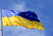 Sea Lanes Snarled — Putin’s Crimea Problem Ukrainian flag waving on a flagpole against blue sky