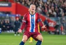 Underdog? Norway Exposes The Favorites Soccer player holding a ball in a stadium with a cheering crowd