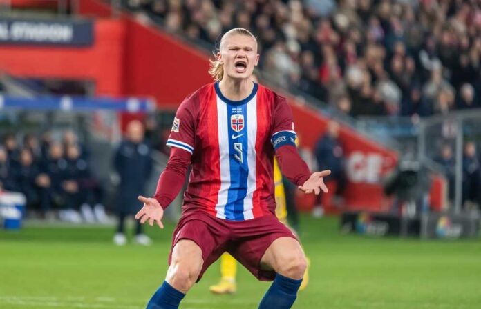 Oslo,,Norway,,November,17,,2024.,Norway,National,Football,Team Soccer player holding a ball in a stadium with a cheering crowd