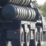 Turkey’s S-400 Shuffle Rattles Washington A military missile system positioned on a grassy field during sunset