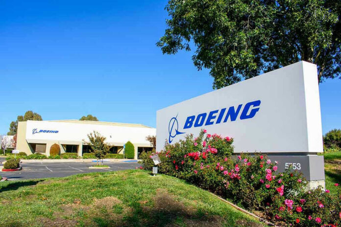 2409733907 Boeing office building with signage and landscaping.