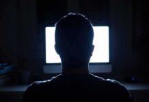 Contractor Threat Leads to Gut-Punch Discovery person silhouetted in front of a bright computer screen