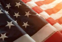 Equality Fight Explodes: Rights Or Forced Results? American flag with stars and stripes