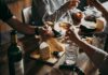 Bizarre Age Cutoff At Dinner Triggers Missouri Firestorm Hands toasting wine glasses over a cheese board