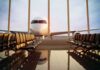 Border Chaos Triggers U.S. Travel Warning Airplane seen through terminal windows with empty gate seating