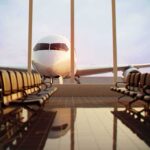 Border Chaos Triggers U.S. Travel Warning Airplane seen through terminal windows with empty gate seating
