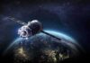 Satellite orbiting Earth over night side