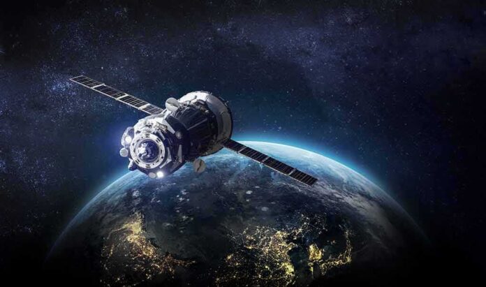 Satellite orbiting Earth over night side
