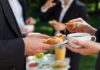 Budget Loophole Closed — $499 Or Bust Professionals enjoying refreshments at an outdoor event