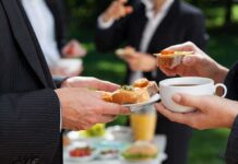 Budget Loophole Closed — $499 Or Bust Professionals enjoying refreshments at an outdoor event