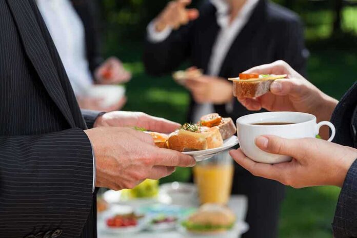 Professionals enjoying refreshments at an outdoor event