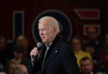 States Rebel: Kill Biden’s ESG Mandate older man speaking into a microphone at an indoor event