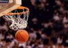 Basketball dropping through a hoop