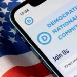 Smartphone showing a political committee webpage on an American flag