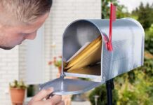 Mailbox Move Sparks Police Call man checking mail in an open curbside mailbox