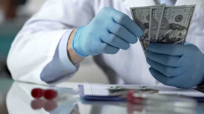 Gloved hands in a lab coat counting US dollar bills