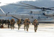 Ignored Sniper Alert — Abbey Gate Doomed Soldiers disembark and walk past a large military helicopter
