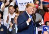 Government-Funded Trump Ad Sparks Uproar Donald Trump at a rally raising his fists on stage