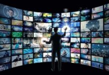 10% Ad Surcharge Raises Legal Alarms Person interacting with curved wall of digital screens