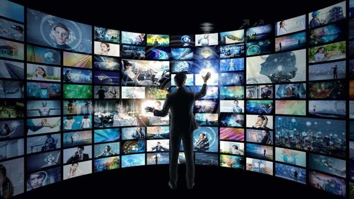 shutterstock_1149399665-1 Person interacting with curved wall of digital screens