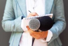 Anchor’s ‘Gotcha’ Crumbles – Rushed Fact-Check Implodes on Live TV Journalist holding microphones and notepad
