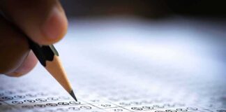 Pencil marking answers on a multiple-choice test sheet