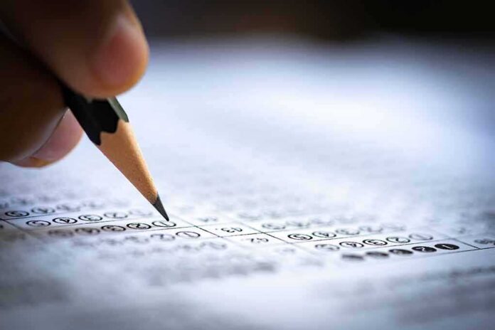 shutterstock_1219746331 Pencil marking answers on a multiple-choice test sheet