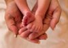 Judge Recognizes Aborted Child’s Rights Adult hands cradling a newborn's tiny feet