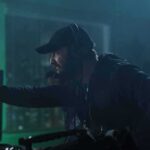 Broadcast Pull Stuns Kimmel — What Spooked ABC? man with headset gestures while working at a control station