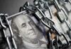 Yield Shock: Valuations On The Brink US dollar bills wrapped in metal chains