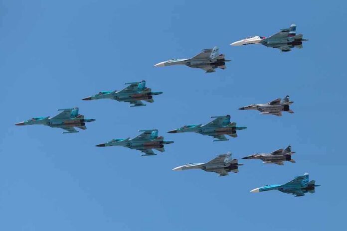 shutterstock_141377446 A formation of military jet fighters flying in a clear blue sky