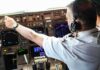 Booze Allegation – Wild Misrata Crash Sparks Pilot Detention Pilot adjusting controls in an airplane cockpit