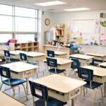 Cat-in-the-Hat Panic Closes Schools Empty classroom with rows of student desks and chairs