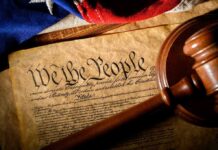 Trump’s Constitution Move Stuns Xi U.S. Constitution with gavel and flag