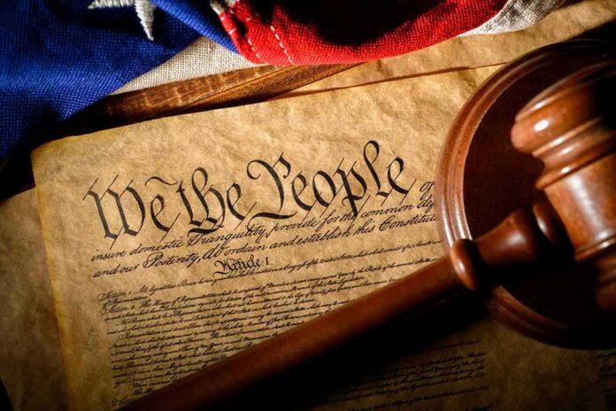 U.S. Constitution with gavel and flag