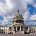 Family Values Shattered: Resign Now Calls Boom United States Capitol building under a partly cloudy sky