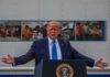 U.S. Claims Control – Tehran’s Bargain Tossed Donald Trump speaks at a podium with arms outstretched