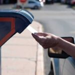 Supreme Court FREEZES Trump’s Mail-Ballot Move Hand mailing an envelope into a blue mailbox