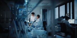 Scientists working in a dim laboratory