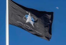 Space Weapons, Confirmed – What’s Really Up There? United States Space Force flag waving against a blue sky