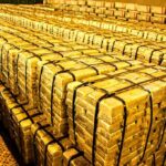 Geopolitics Jolt: Gold Leaves U.S., Canada Stacks of gold bars strapped together in a vault