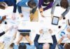Leadership Stipends – For Immigrants Only Group of professionals collaborating around a conference table