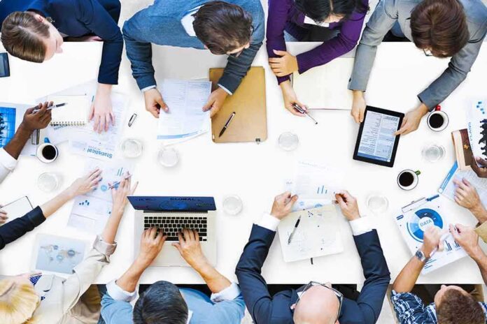 Group of professionals collaborating around a conference table